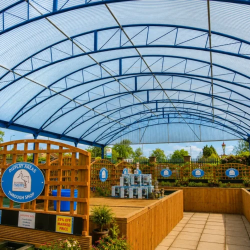 Bespoke retail canopy creating a weather-protected outdoor display and customer browsing area