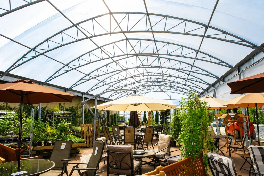 MGM Large-span garden centre canopy creating covered retail space for outdoor furniture, plants and seasonal displays